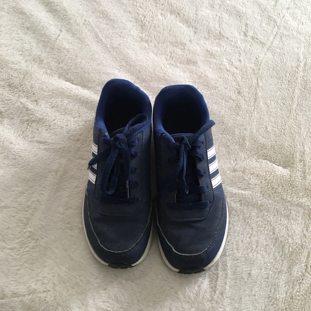 Boys Adidas sneakers.